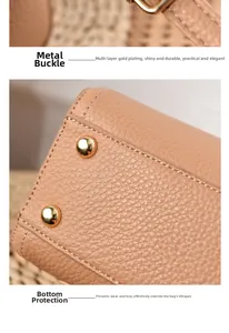 Detail of lychee pattern leather handbag with gold-plated buckles and protective base studs