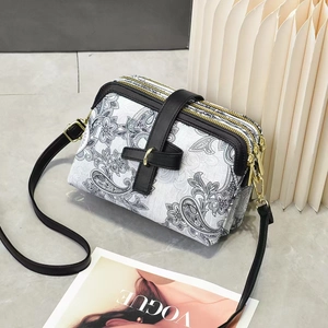 Vintage floral triple zipper crossbody bag with paisley print and black leather trim