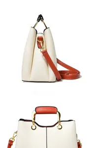 Detail view of contrast stitching and side embossed texture on women crossbody bag