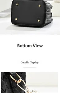 Close-up of black woven bucket bag bottom with golden studs and metal hooks