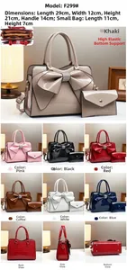 Close-up of glossy crocodile pattern faux leather handbag with a large decorative bow