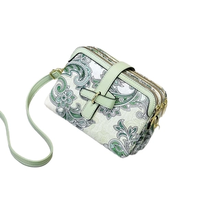 Vintage green paisley print crossbody bag with triple zipper and adjustable strap