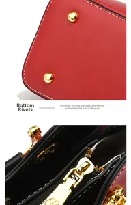Detail einer roten Kieselleder-Handtasche mit goldenen Bodenieten und weißen Nähten