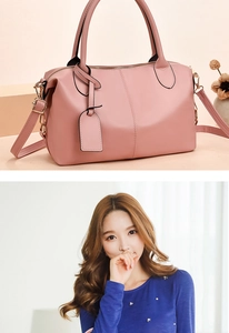 Detail of pink fashion handbag with stitch patterns and detachable shoulder strap