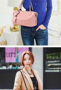 Close-up of pink Boston bag featuring gold hardware and a detachable crossbody strap