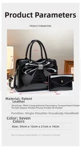Maßangaben der schwarzen Lackledertasche mit Krokoprägung und dekorativer Schleife