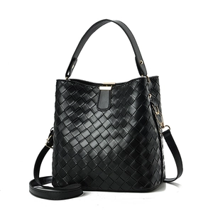 Classic black woven bucket bag with elegant golden hardware and adjustable shoulder strap