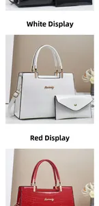 Detail of elegant crocodile-patterned tote bag set with matching clutch in white and red