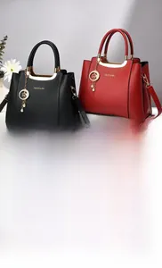 Detail view of lychee texture leather bags with gold handles and star pendant decoration
