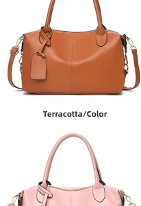 Detail view of khaki and pink PU leather handbags with metal hardware and dual handles