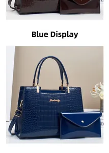Deep blue faux crocodile leather handbag with golden metal logo and matching small clutch