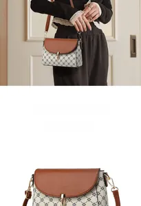 Close-up of vintage beige crossbody bag with floral pattern and brown leather flap