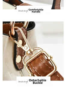 Dettaglio del manico confortevole e chiusura rimovibile in oro chiaro della borsa