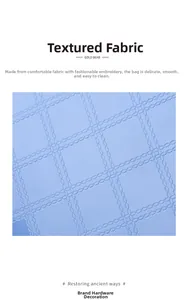 Detailed close-up of light blue rhombic quilted embroidery fabric with smooth texture
