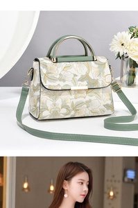 Détail de broderie florale sur sac crème avec une poignée ronde en métal doré chic