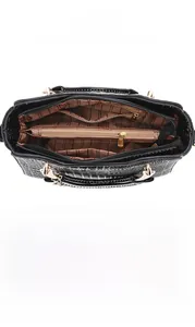 Interior view showing large capacity and multi-layer zipper pockets of black tote bag