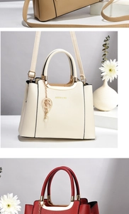 Close-up of lychee grain leather tote bags in cream, khaki, and burgundy with metal charms