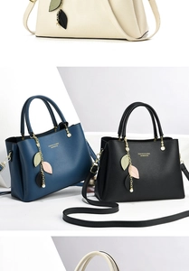 Detail of lychee pattern leather bags with gold leaf charms in three classic colors