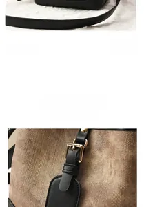 Détail du sac seau vintage avec bandoulière en cuir noir et boucles métalliques dorées