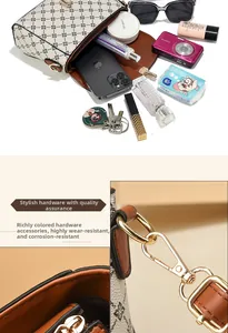 Detail of vintage crossbody bag interior space and premium gold-tone metal hardware