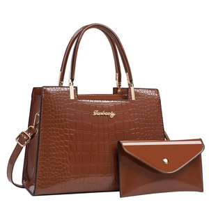Brown crocodile embossed leather handbag set with gold hardware and shoulder strap