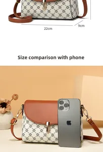 Detailed dimensions of retro crossbody bag showing 22cm length compared to a smartphone