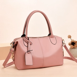 Pink minimalist faux leather Boston bag for women with top handles and adjustable strap