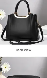 Detail view of black lychee leather handbag with gold handle and sturdy base structure
