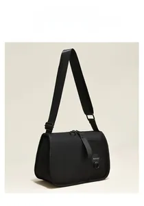 Detail of high-density black nylon crossbody bag with adjustable wide fabric strap