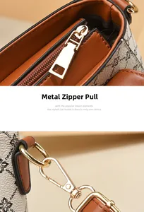 Detail of golden hardware zipper head and metal strap hook on vintage flap handbag