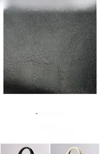 Close-up of soft lychee pattern leather texture on a minimalist tote bag in black and beige