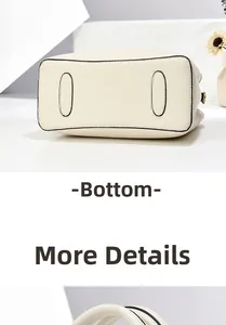 Close-up of the beige lychee grain leather handbag base and fine stitching detail