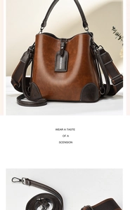 Detail view of vintage brown bucket bag with reinforced base corners and dual straps