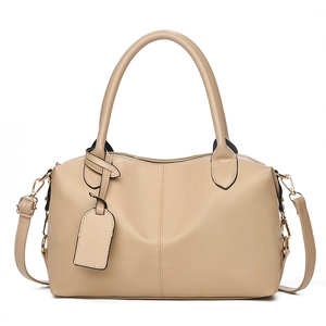 Elegant beige matte leather Boston bag for women with dual handles and shoulder strap