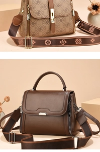 Detail showing vintage brown textured leather handbag with a stylish wide woven shoulder strap
