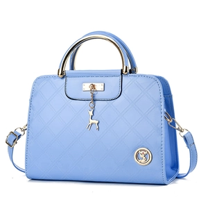 Light blue patent leather handbag with quilted pattern and gold circular handle