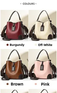 Macro shot of stylish vintage bucket bags in burgundy, beige, yellow and pink colors
