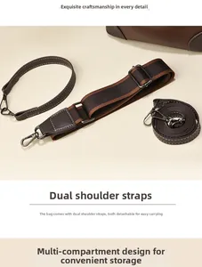 Detail of detachable leather handles and striped wide shoulder straps for bucket bags