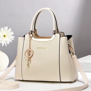Elegant ivory faux leather handbag with lychee texture and detachable shoulder strap