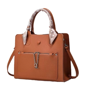 Brown lychee leather handbag with silk scarf handle and silver metal chain detail