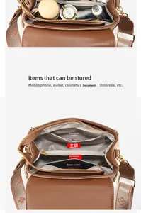 Detailed view of the brown jacquard crossbody bag's spacious multi-compartment interior