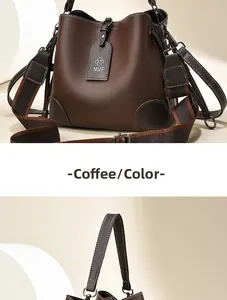 Detail of coffee brown bucket bag with wide strap, metal hooks and logo tag