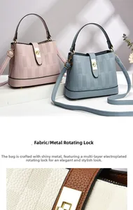 Detailed view of the electroplated rotating metal buckle on a faux leather bucket bag