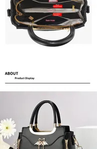 Detailed interior compartments of black faux leather handbag with golden swan heart clasp