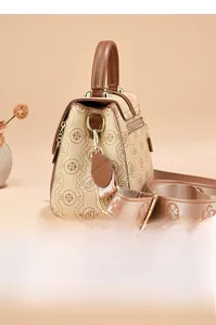 Detail view of vintage patterned crossbody bag with wide jacquard shoulder strap