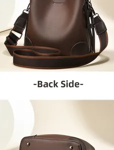 Detail of dark coffee bucket bag with leather texture and protective metal base rivets