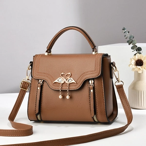 Brown litchi grain leather handbag with golden swan heart buckle and pearl charm