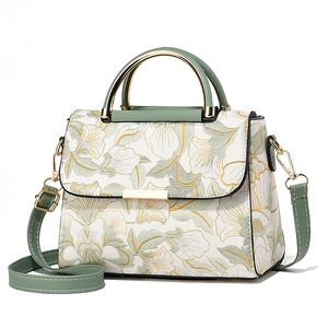Sac à main élégant brodé de fleurs avec poignée verte et bandoulière amovible chic