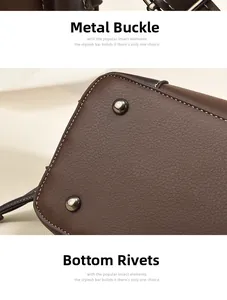 Detail of silver hardware clasp and protective bottom rivets on brown leather bucket bag