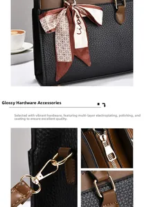 Detail showing multi-layer electroplated gold hardware and floral silk ribbon on leather bag